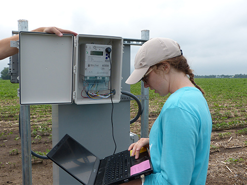Person working on irrigation system