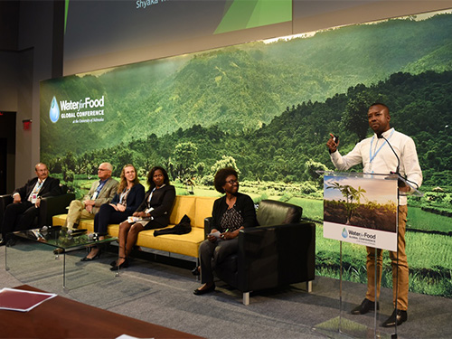 Speakers on stage at conference