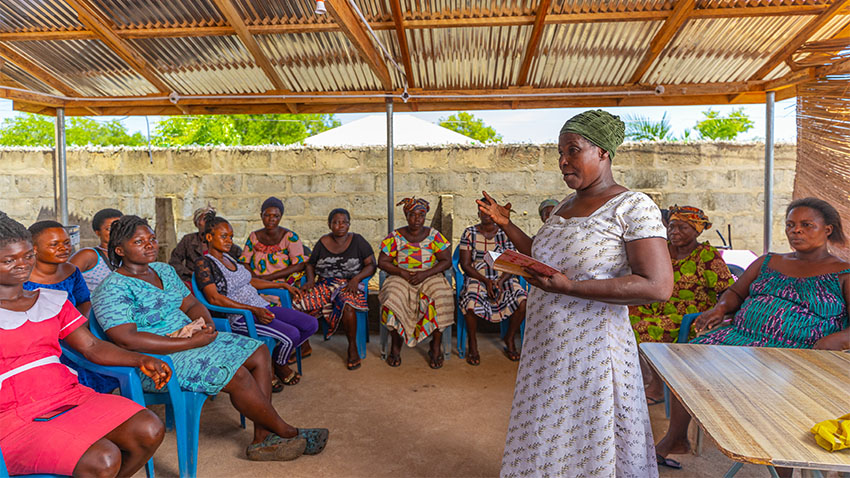 Person standing and talking to group