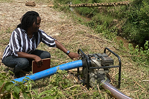 Person working on irrigation pump