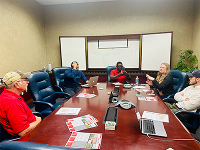 People sitting around table in conference room