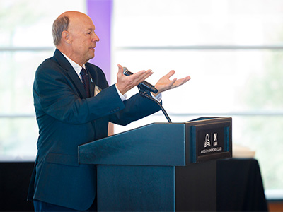 Person speaking in front of podium