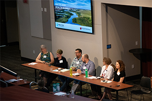 People presenting at conference