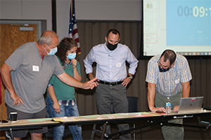 People working together looking at table