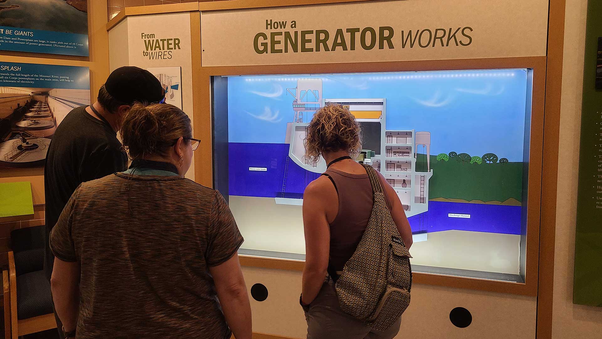 People looking at interactive exhibit