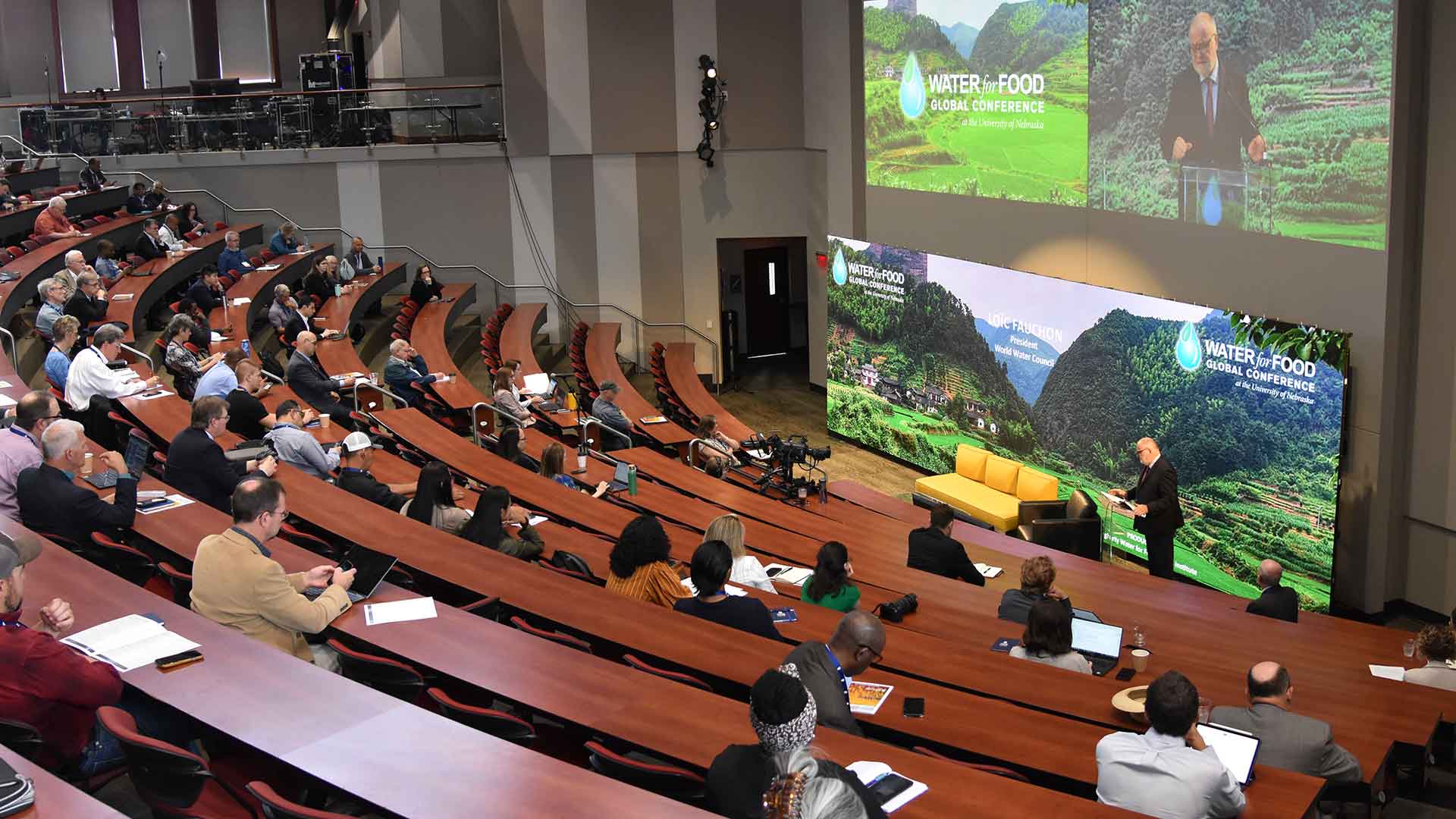 Audience in conference center listening to speaker