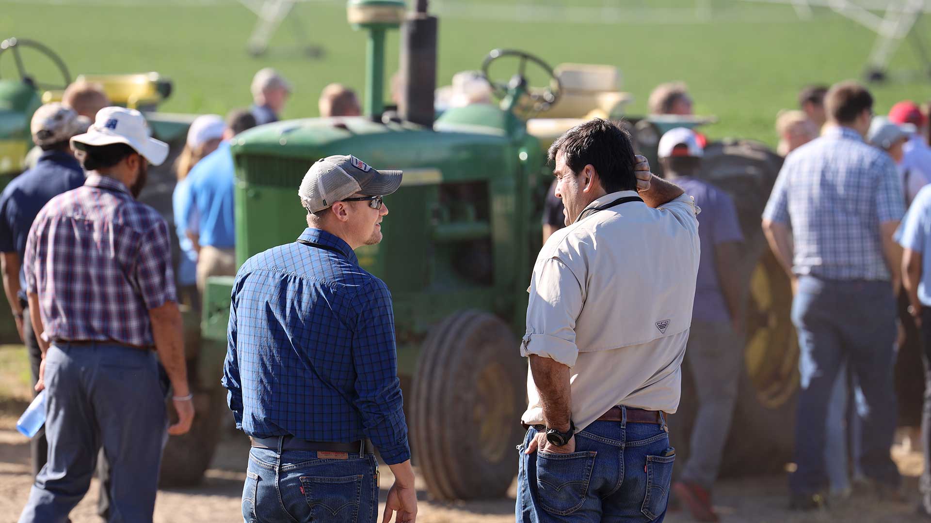 Small group looking at agriculture tractor