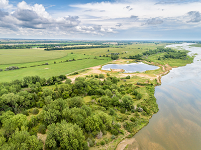 Aerial view of lake beside large body of water