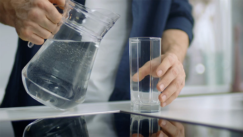 Pouring water in glass