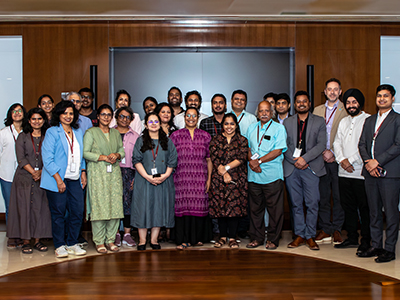 Large group standing looking at camera