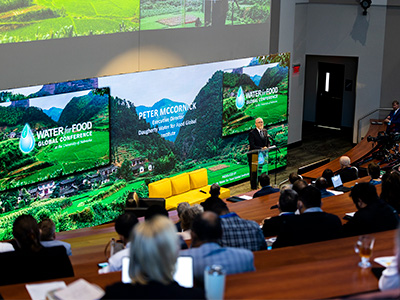 Person speaking in auditorium