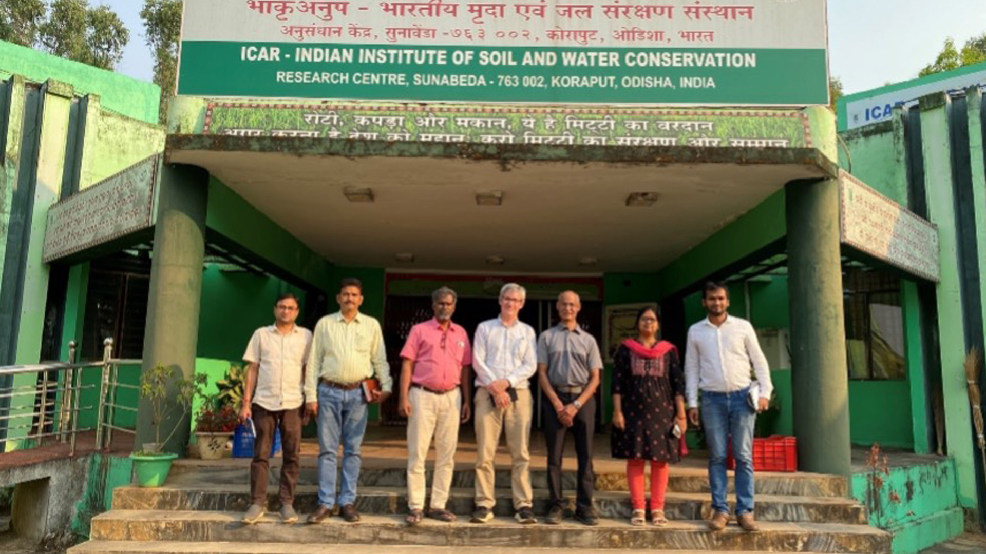 Group of staff standing outside the entrance of the ICAR Indian Institute of Soil and Water Conservation, Research Centre, Sunabeda, Koraput, Odisha, India.