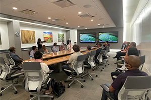 People sitting in meeting room looking at presenter
