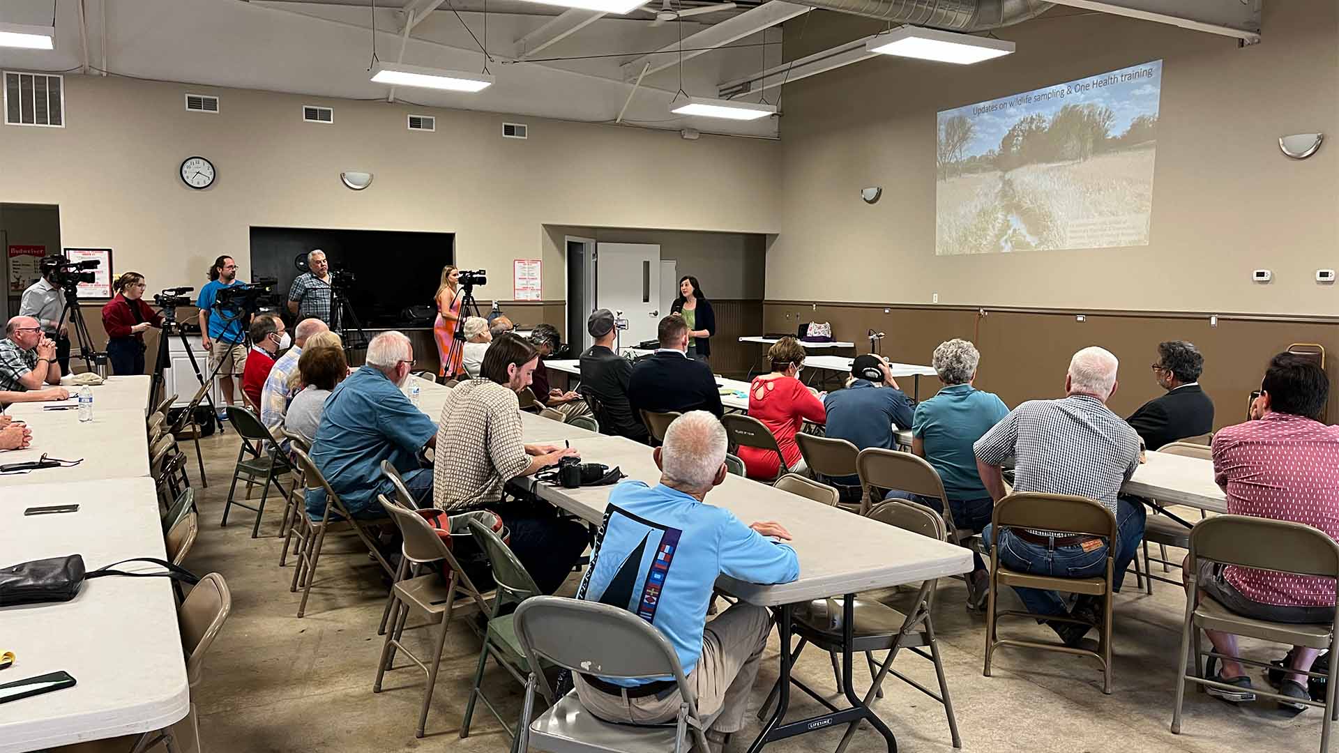 Person giving presentation to audience
