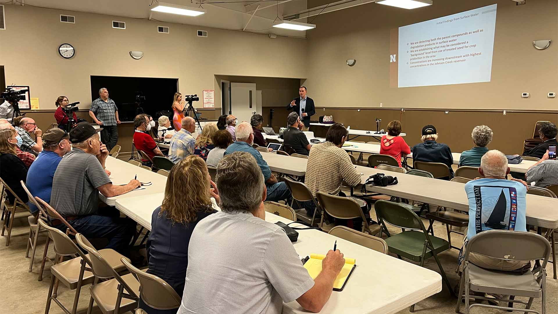 Person giving presentation to audience