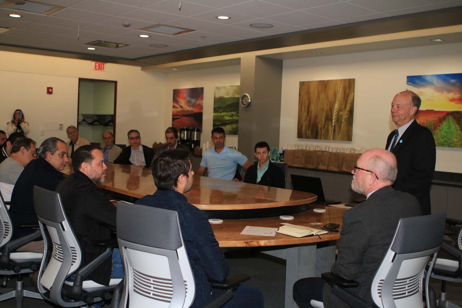 People sitting around table in meeting room