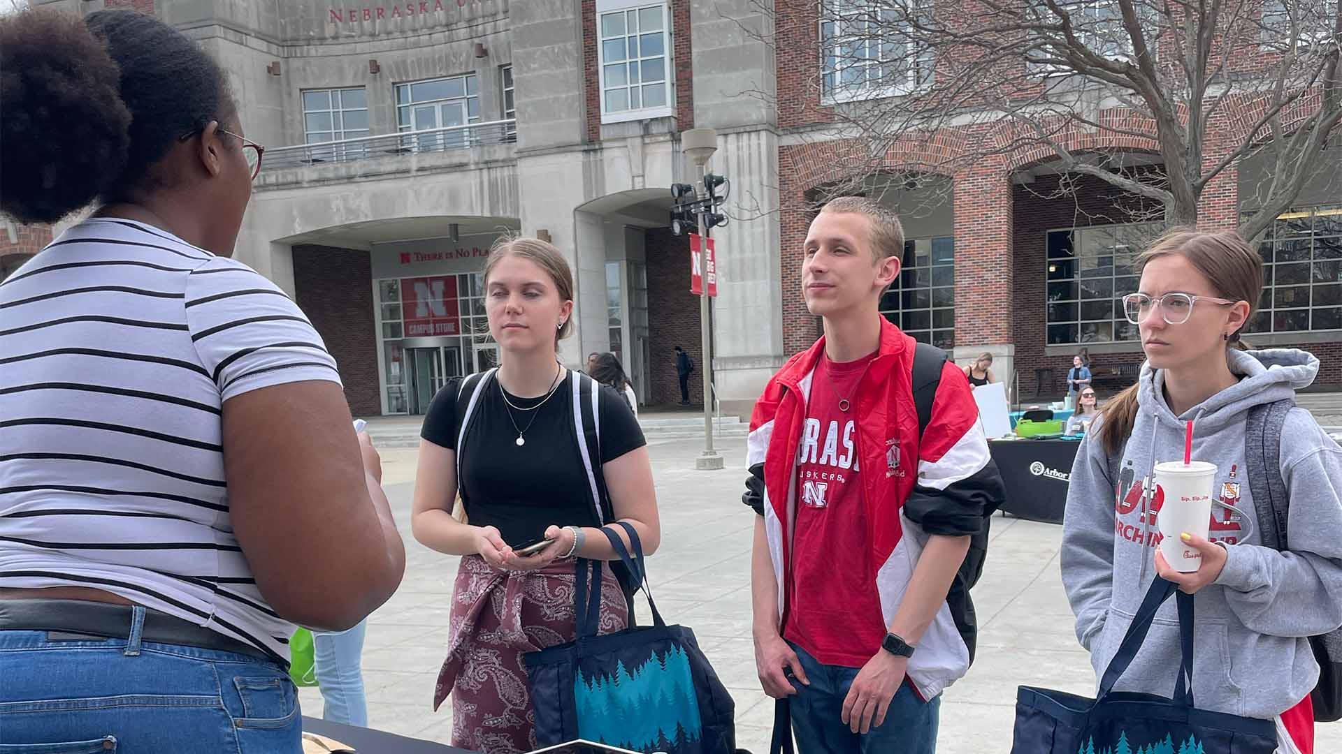 Four people talking in small group