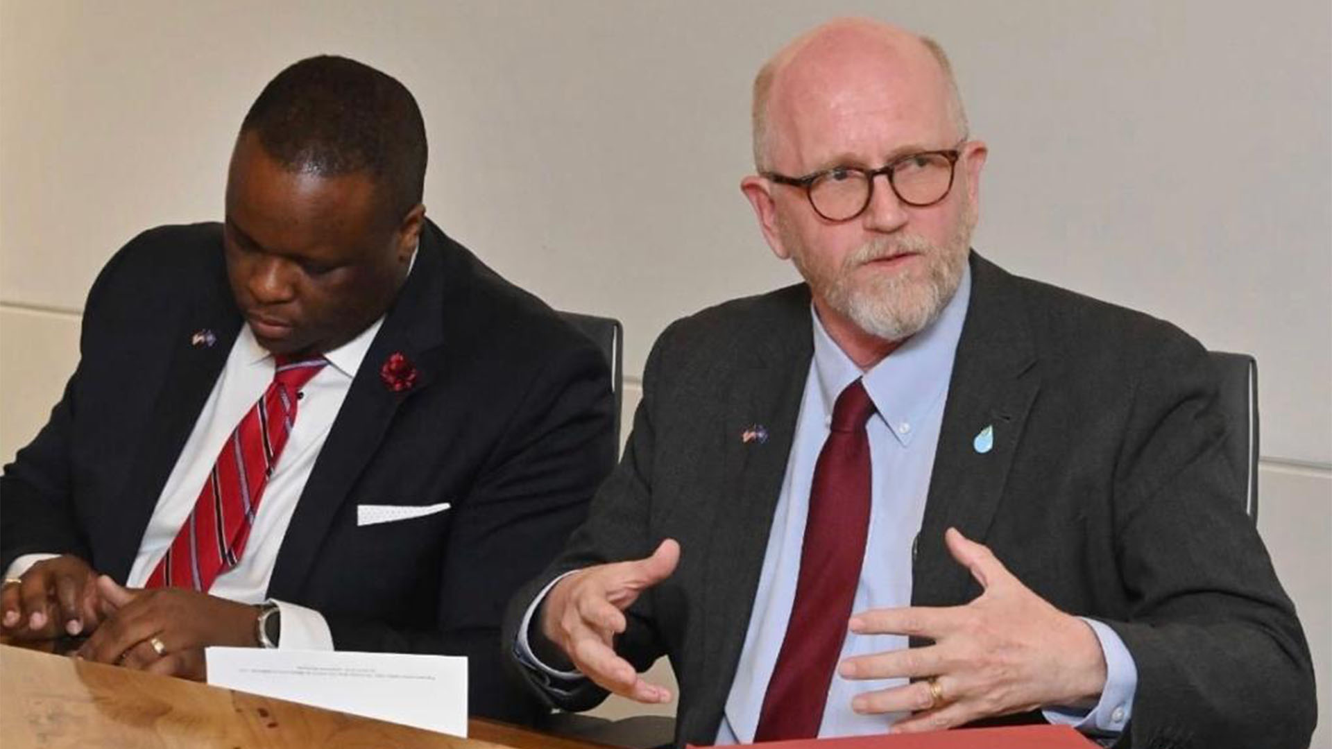 Two people sitting at table
