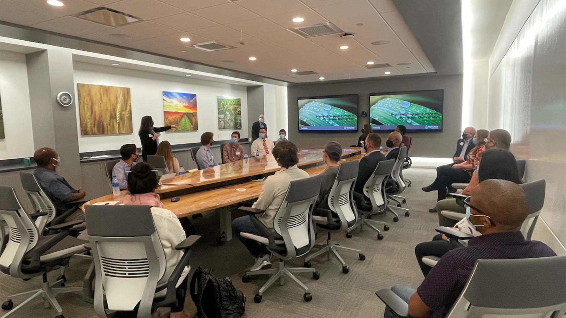 Group sitting at table in conference room