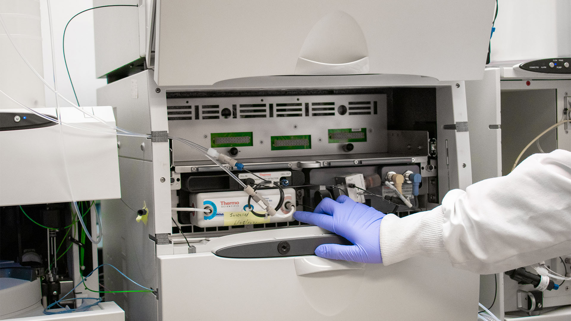 Person working on lab equipment