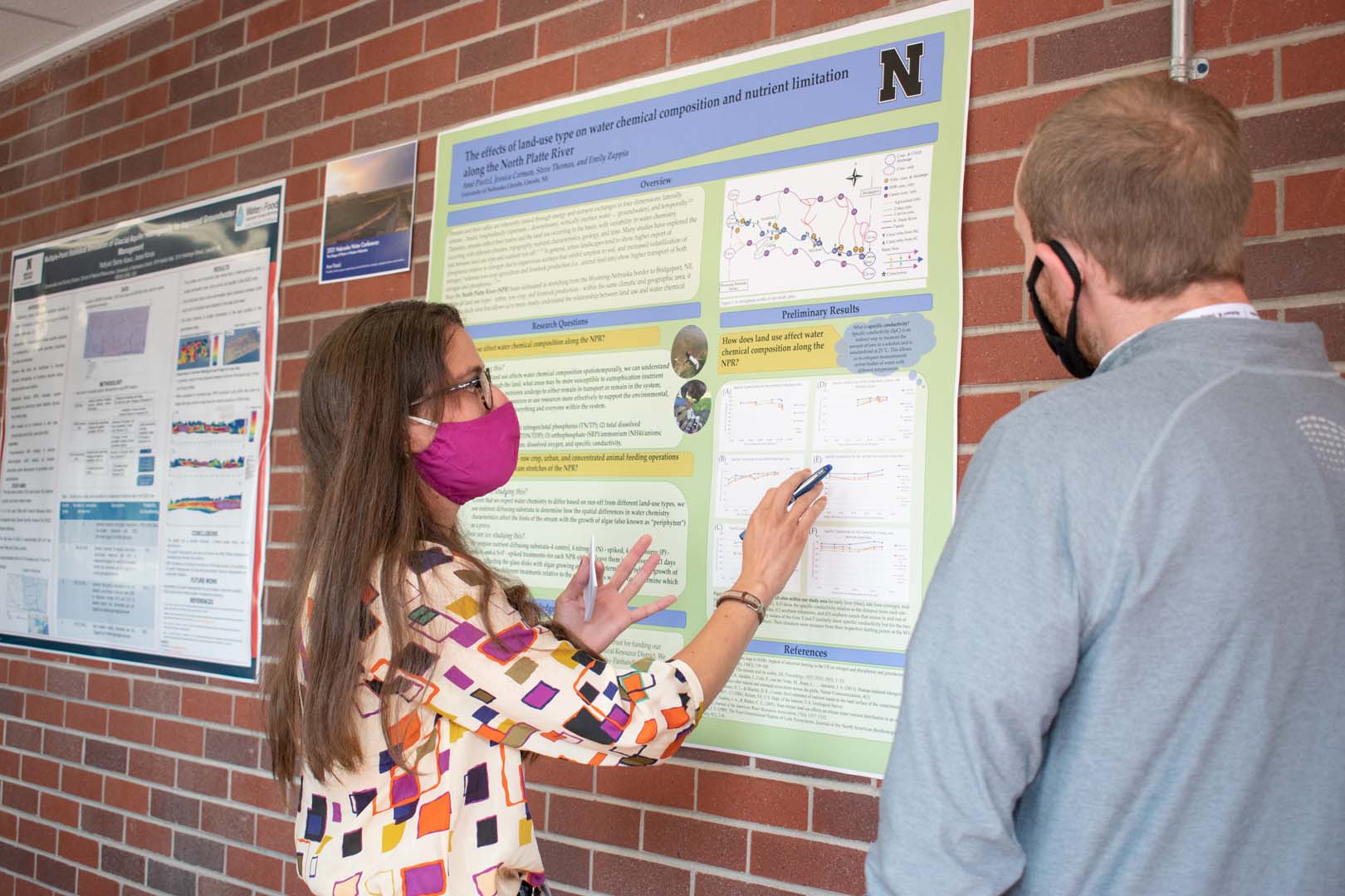 People looking at poster