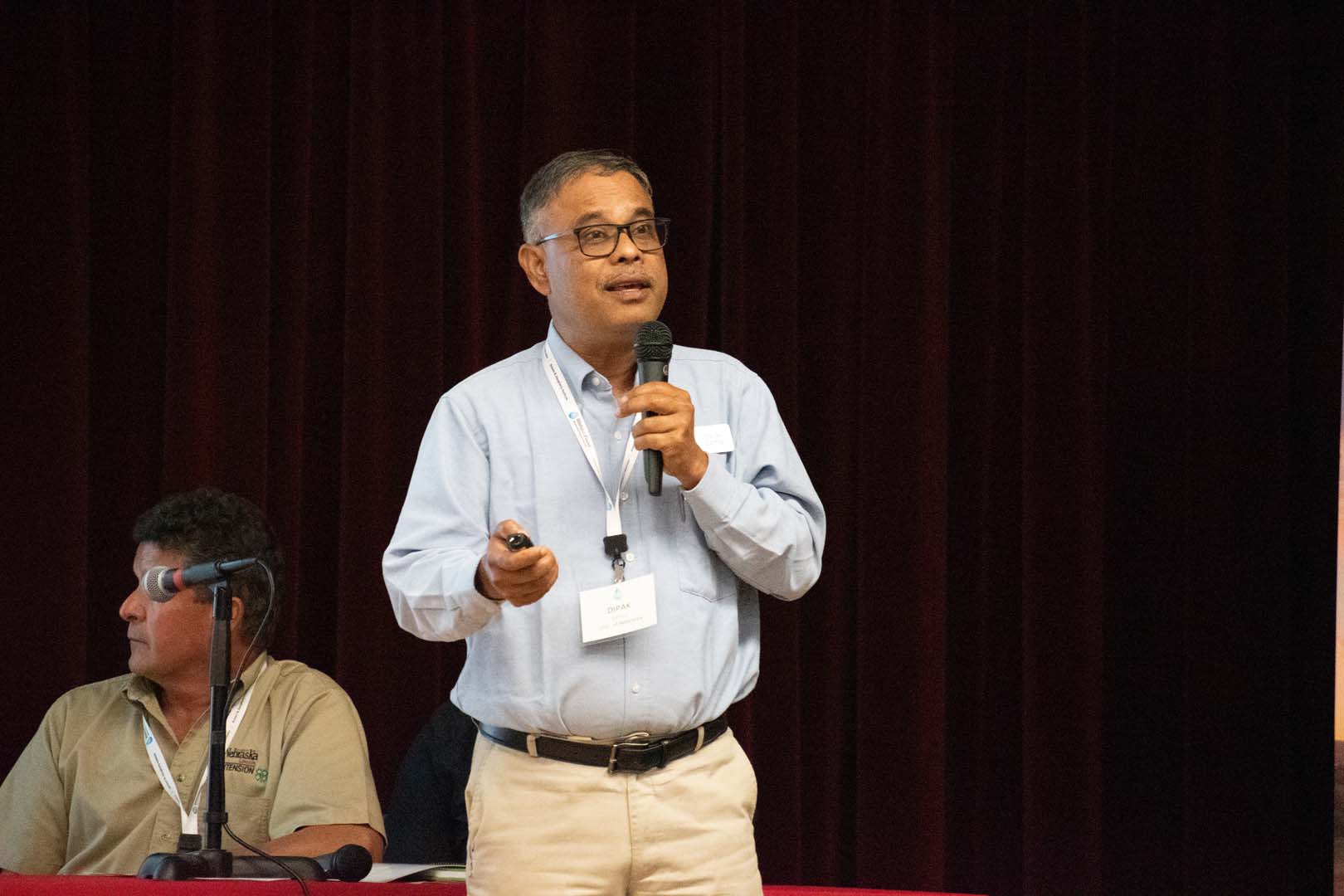 Person presenting with microphone