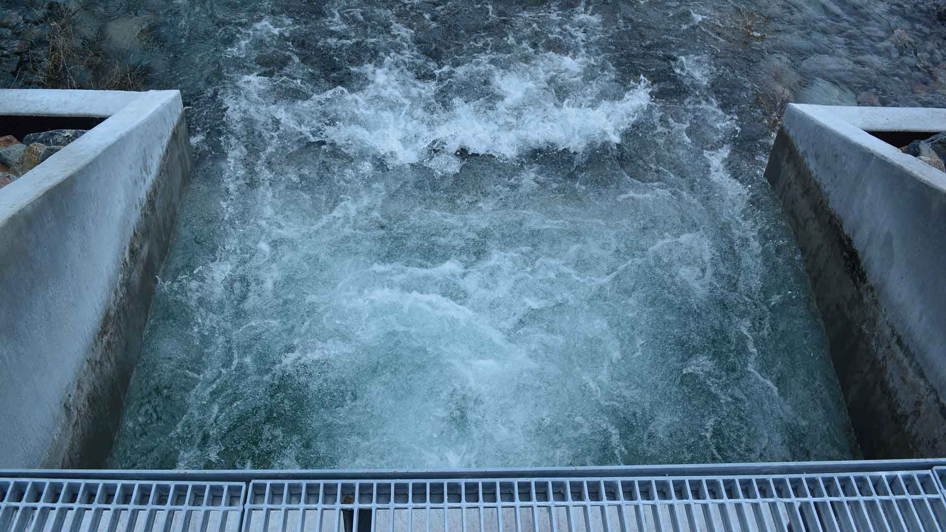 Water running quickly through cement structure
