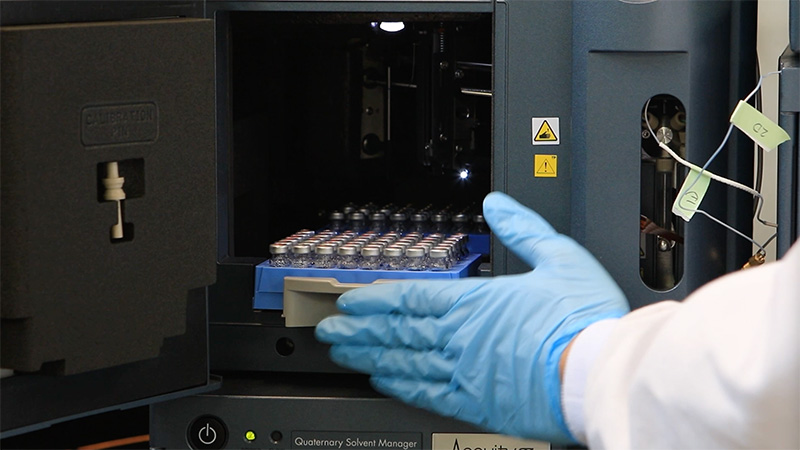 Hand working on laboratory equipment