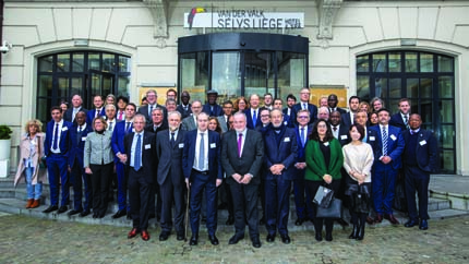 Large group of people standing in front of building