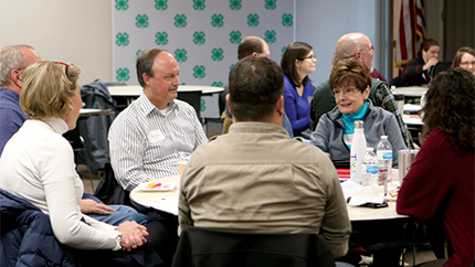 People sitting around table talking